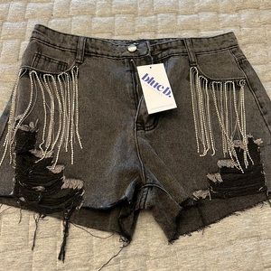 Blue B collection black denim shorts with silver fringe.